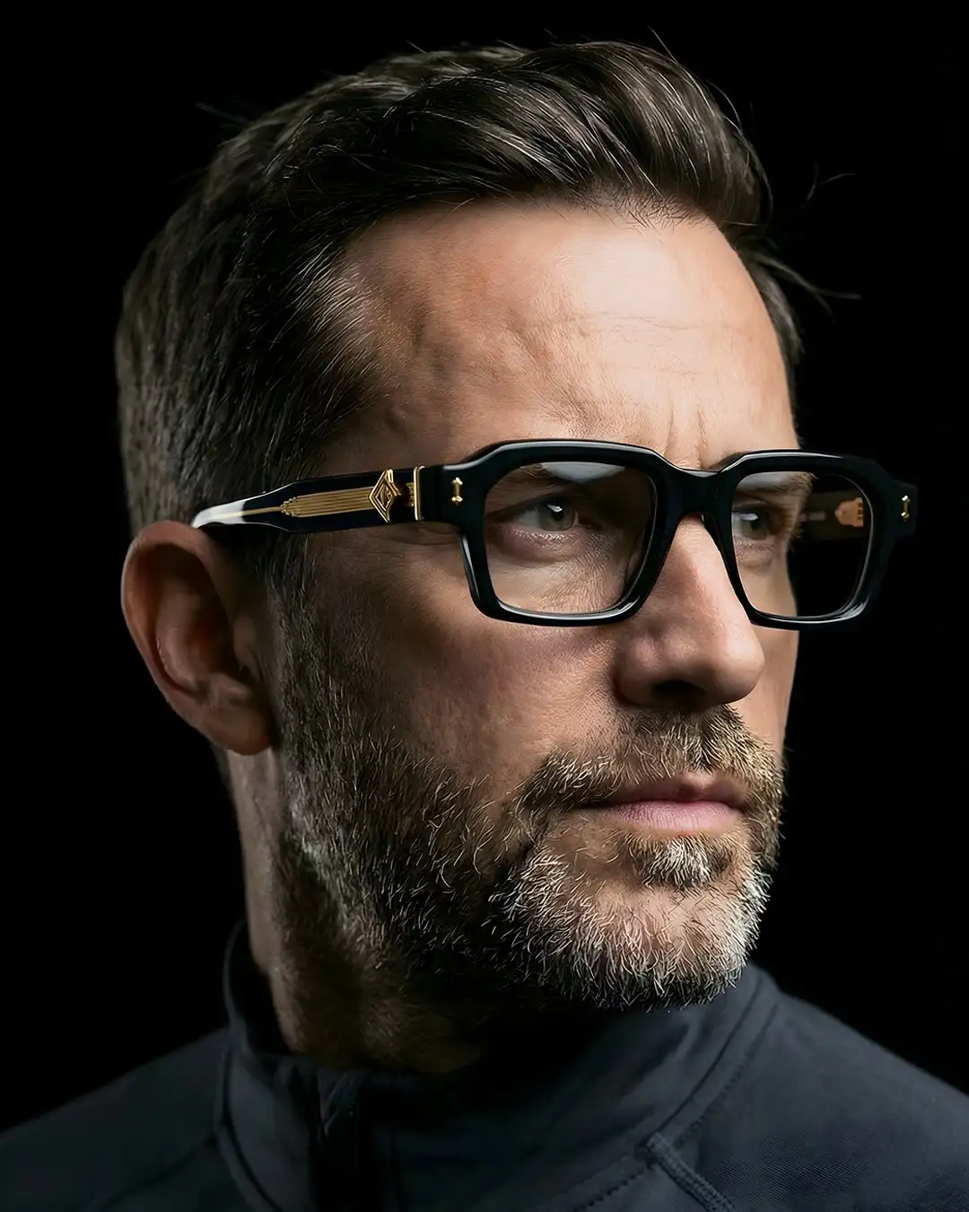 Agbassio The Strategist black acetate eyewear worn by a bearded male model in a refined dark look