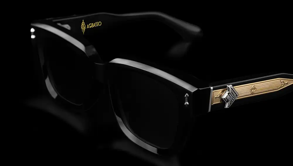 Agbassio The Philosopher black acetate eyewear with gold temple detailing shown from a front three-quarter angle